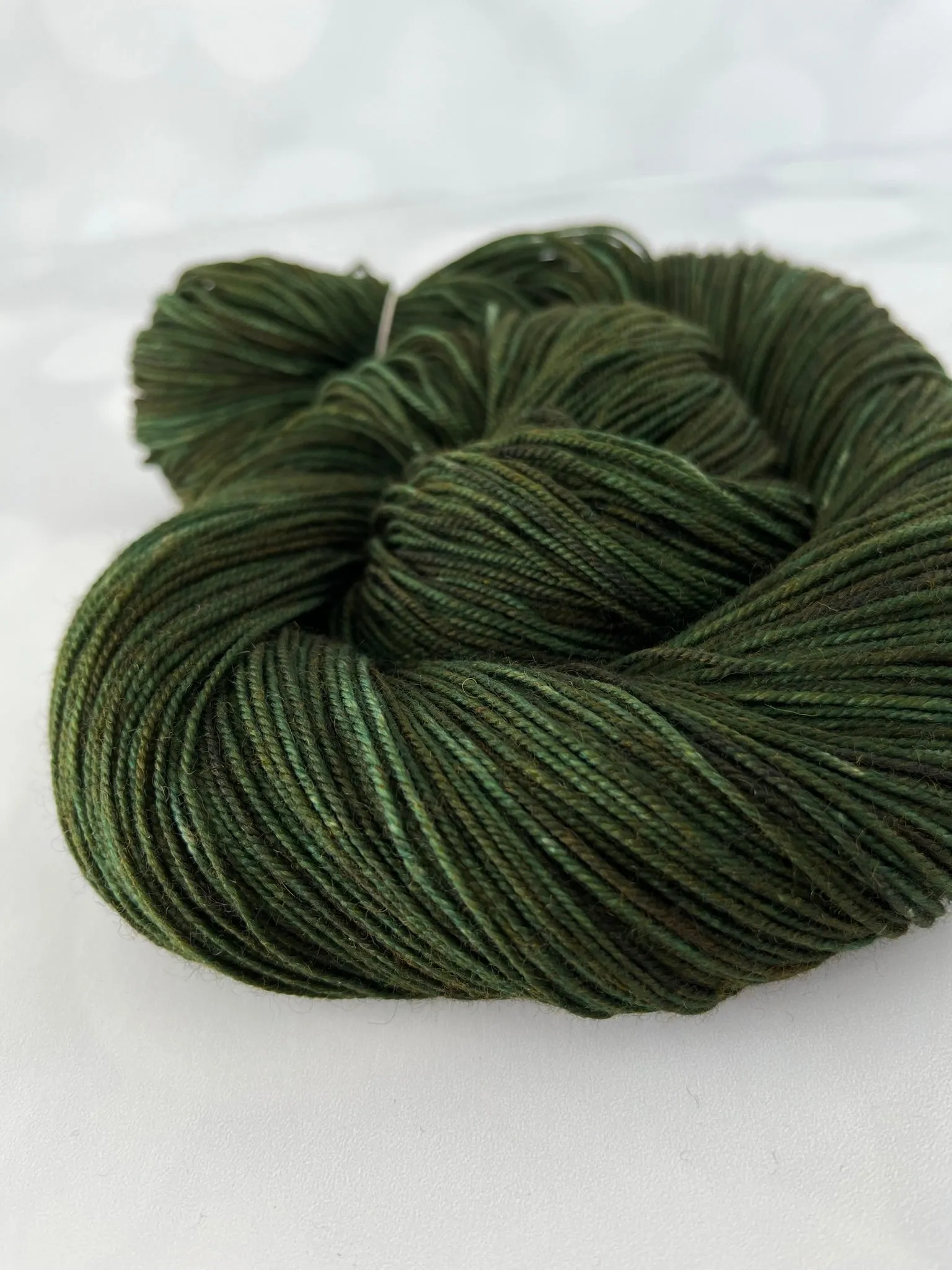 Land Ho! Treasured Yak Toes Sock Yarn, forest green yarn