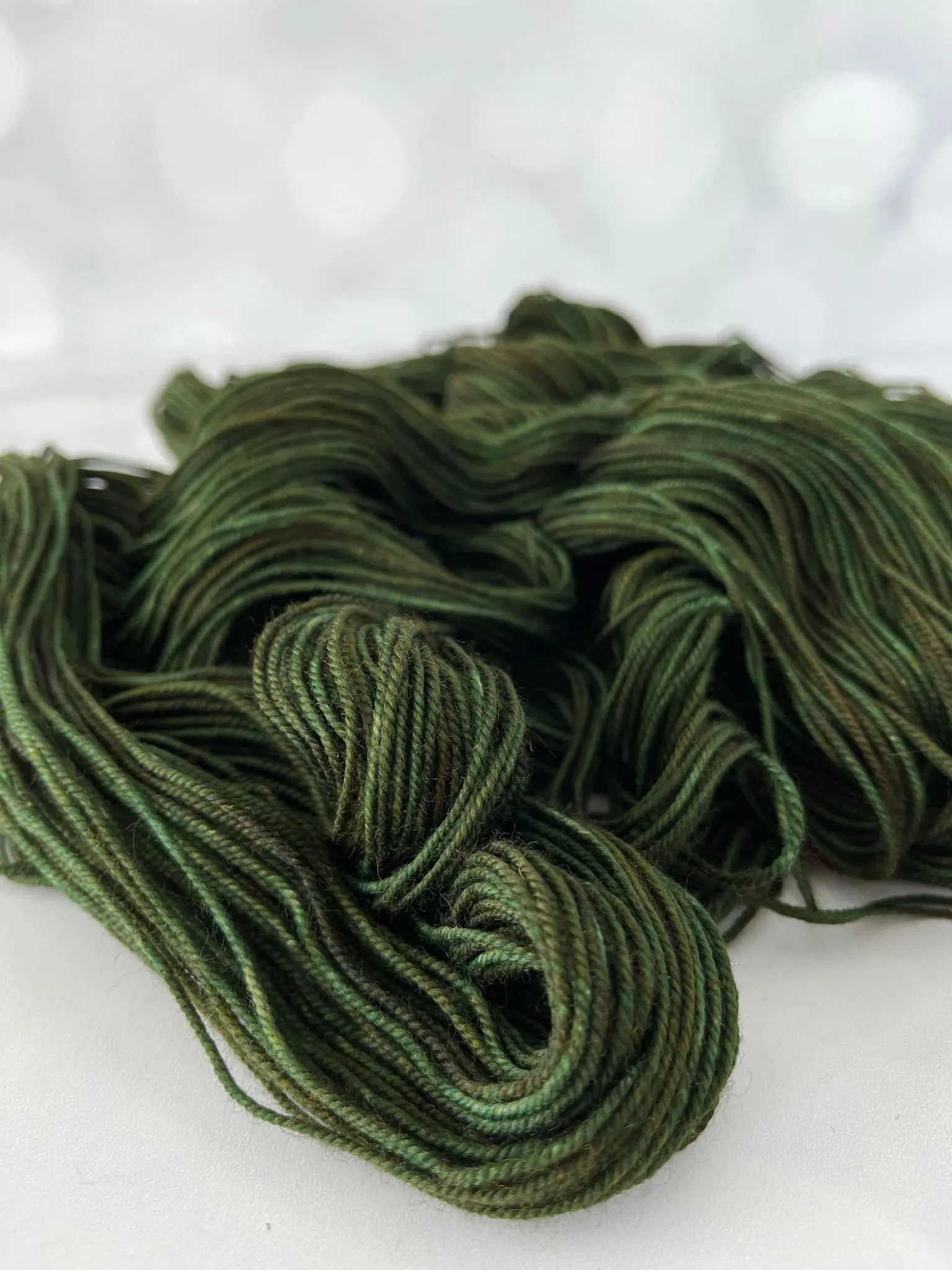 Land Ho! Treasured Yak Toes Sock Yarn, forest green yarn