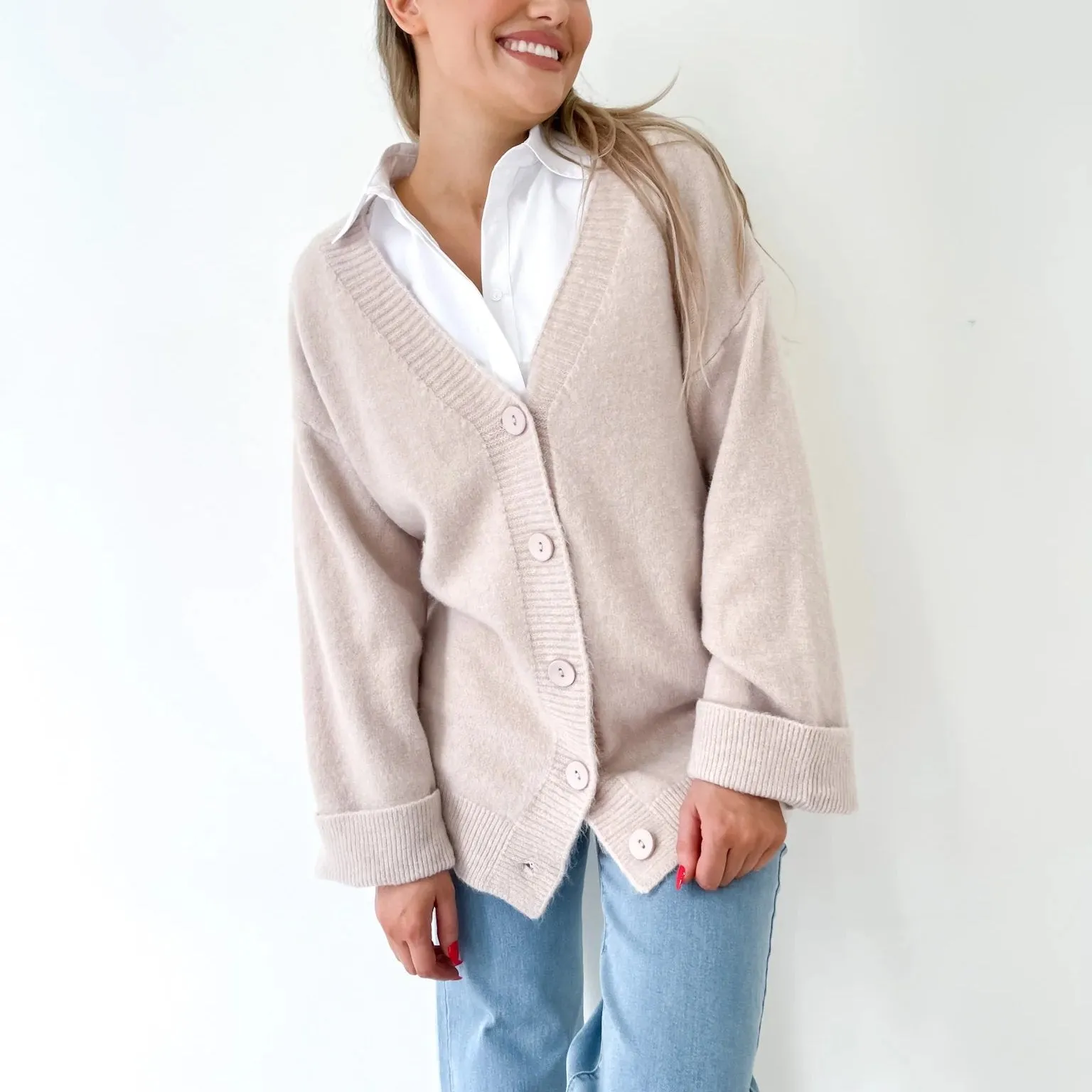 Stone Coloured Winter Cardigan with a generous oversize fit and wide cuffs by Fria the Label.